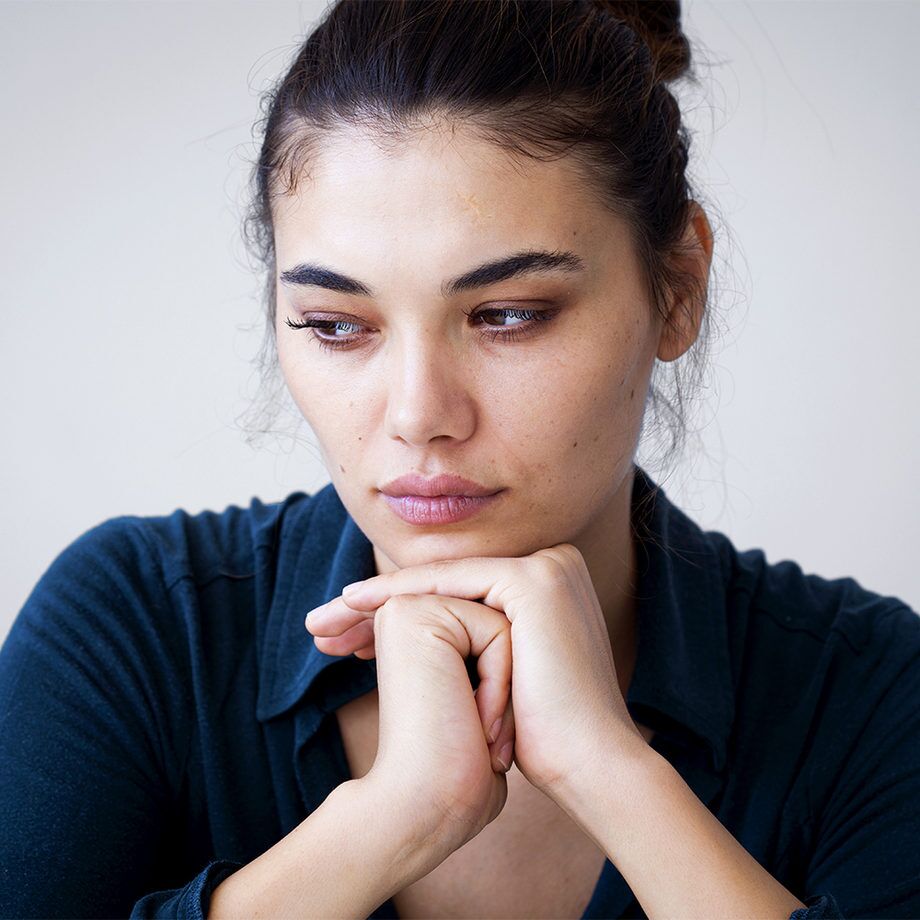 A woman with her eyes closed